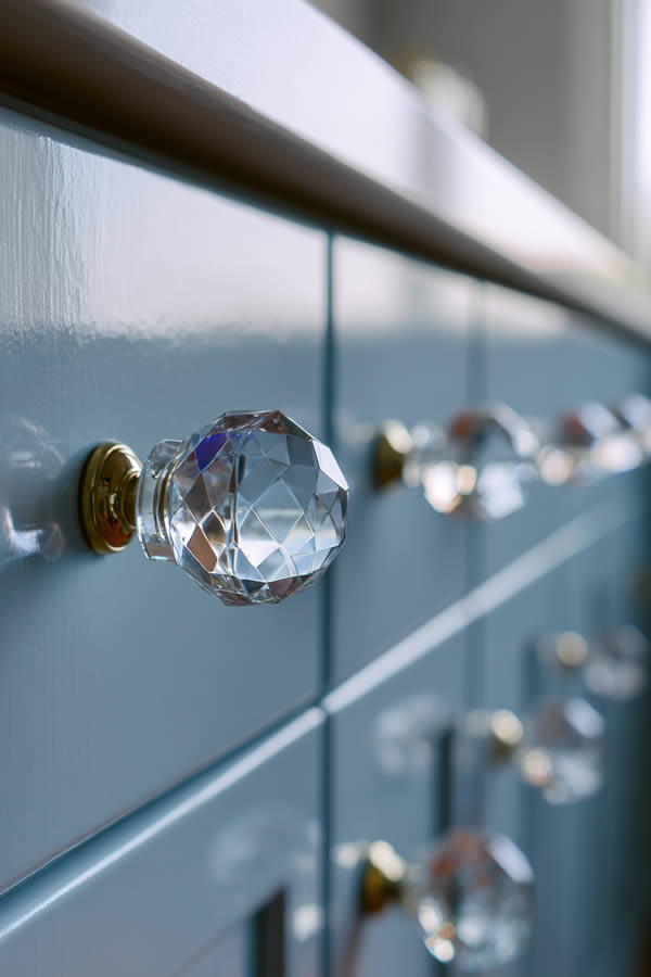 Vintage Glass Knob On A Blue Kitchen Cabinet