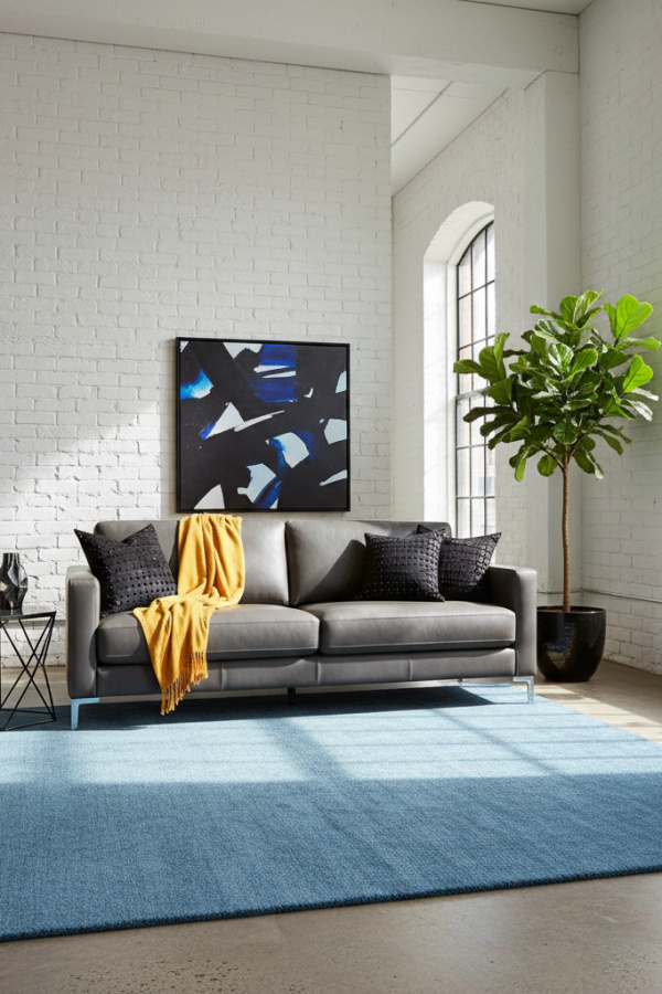 Living Room Blue Rug, Steel Blue Solid, Charcoal Gray Sofa, Black Accents, Bright Industrial Space